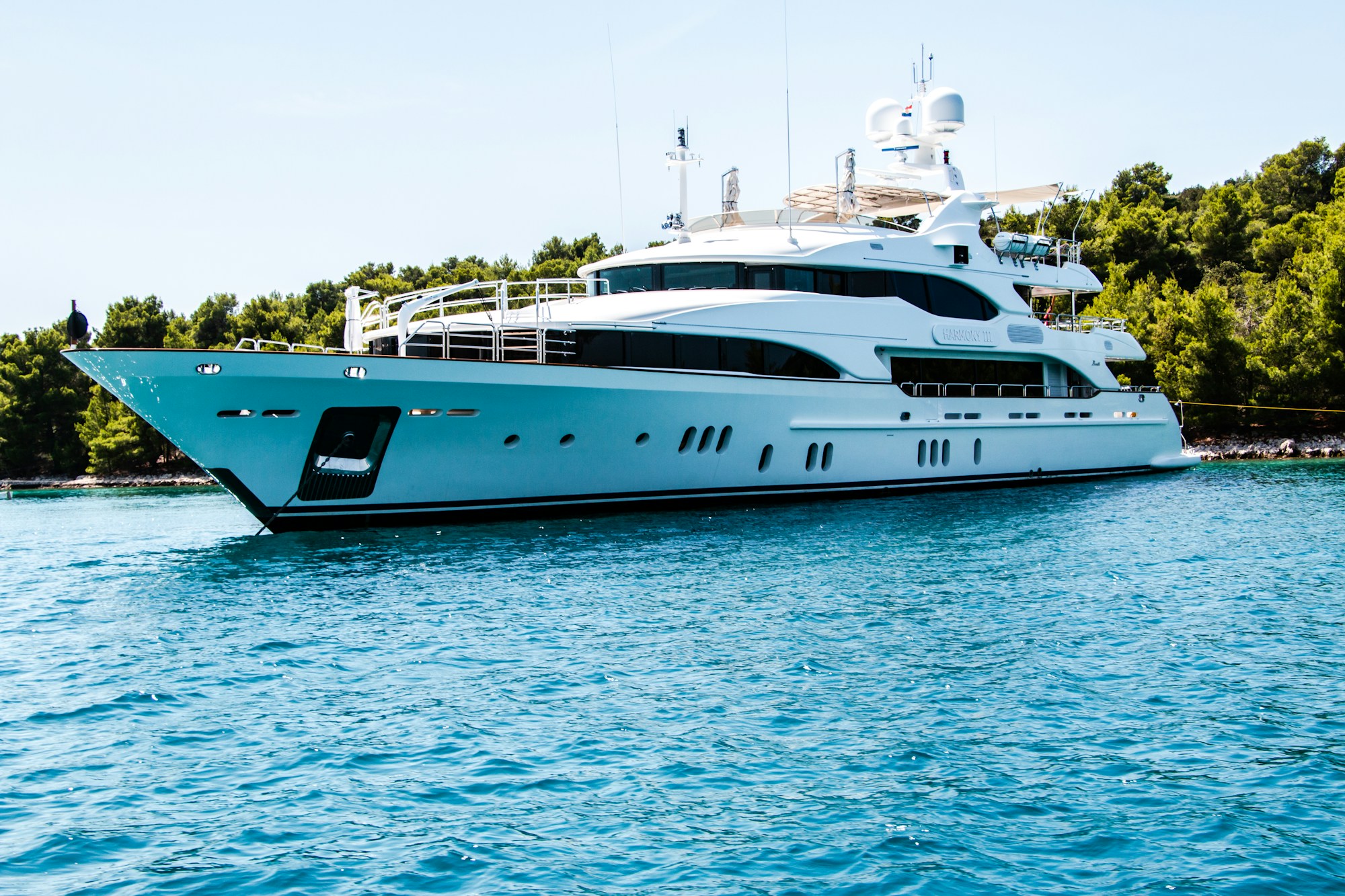 Motor yacht at anchor in clear Mediterranean water